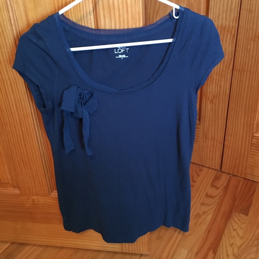 Blue shirt with bow